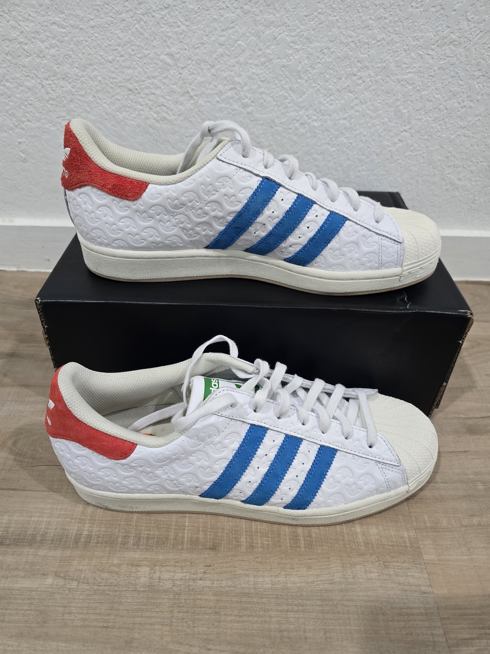 Adidas White Leather Superstar Sneakers with Blue Stripes and Red Heel Tab